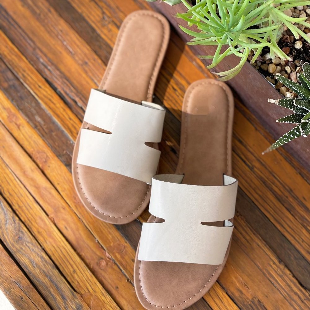 Sand color fashionable slide sandal.